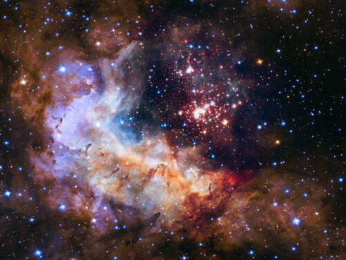 The brilliant tapestry of young stars flaring to life resembles a glittering fireworks display in this NASA Hubble Space Telescope image, which commemorates a quarter century of exploring the solar system and beyond.