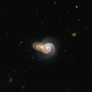 Hubble-Sees-Two-Overlapping-Galaxies