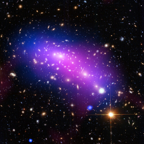 Hubble Looks Into a Cosmic Kaleidoscope

This cosmic kaleidoscope of purple, blue and pink marks the site of two colliding galaxy clusters.