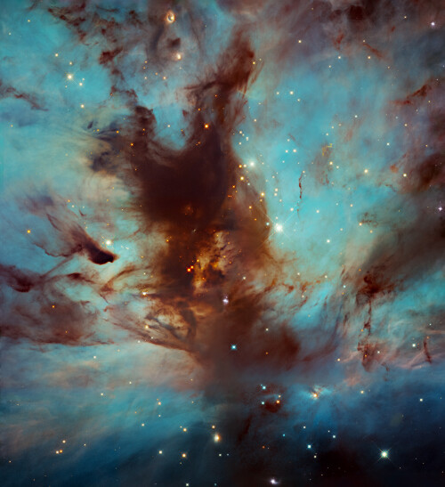 The Flame Nebula, also called NGC 2024, is a large star-forming region in the constellation Orion that lies about 1,400 light-years from Earth.